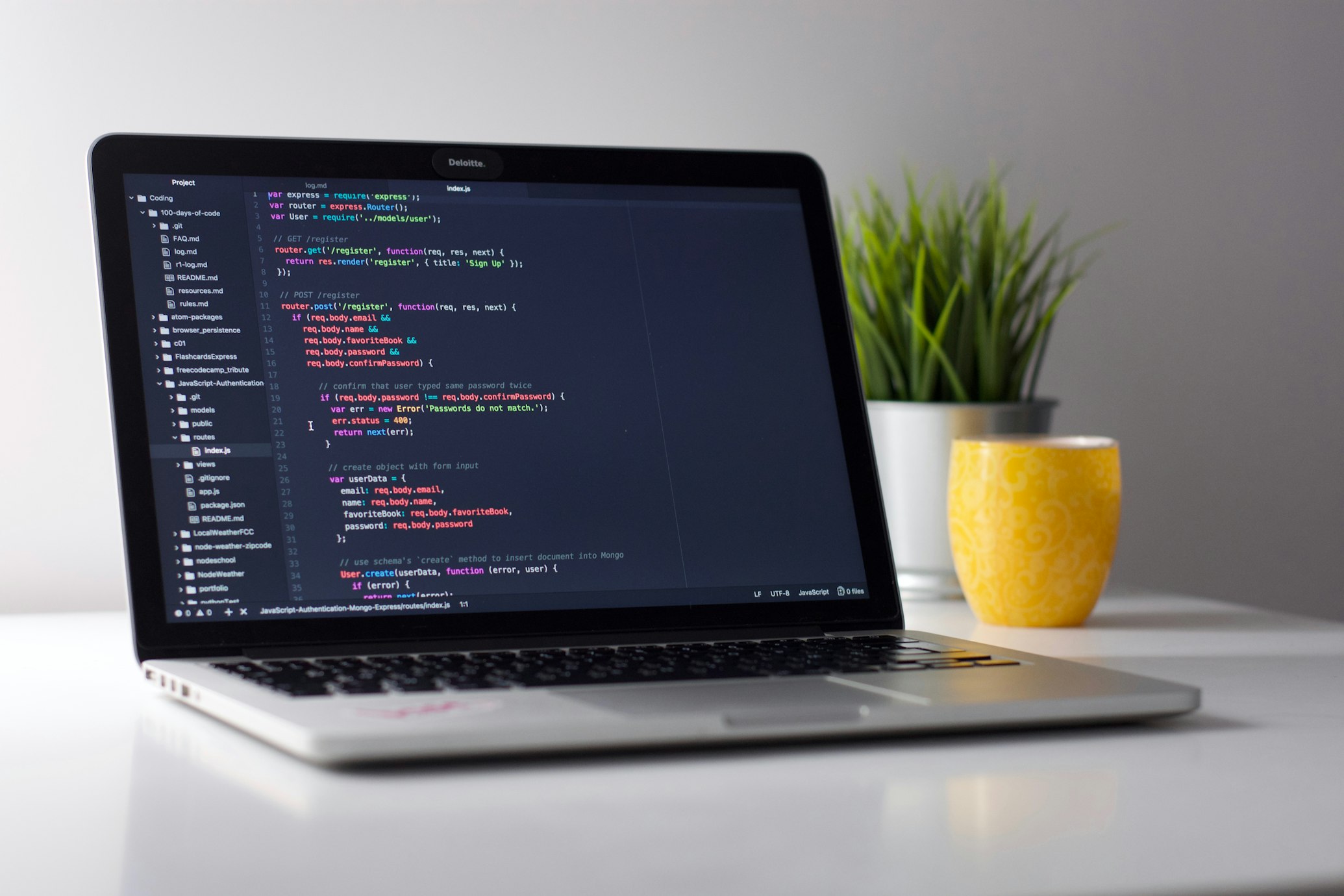 Clean modern developer workstation with laptop