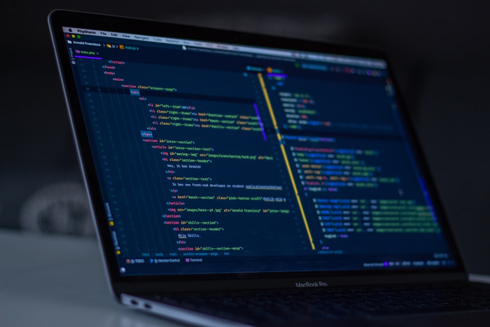 Laptop displaying lines of code